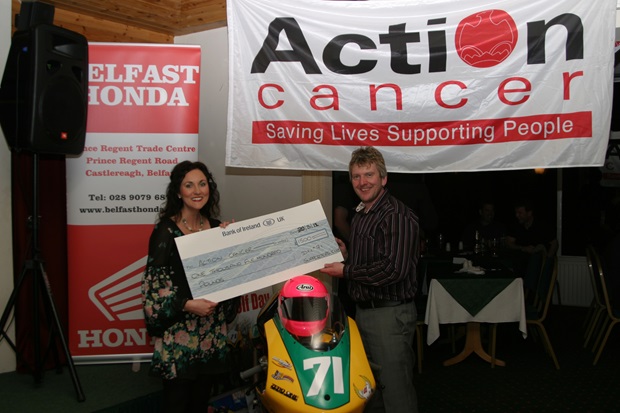 Kerry Anderson of Action Cancer receives cheque from Davy Morgan